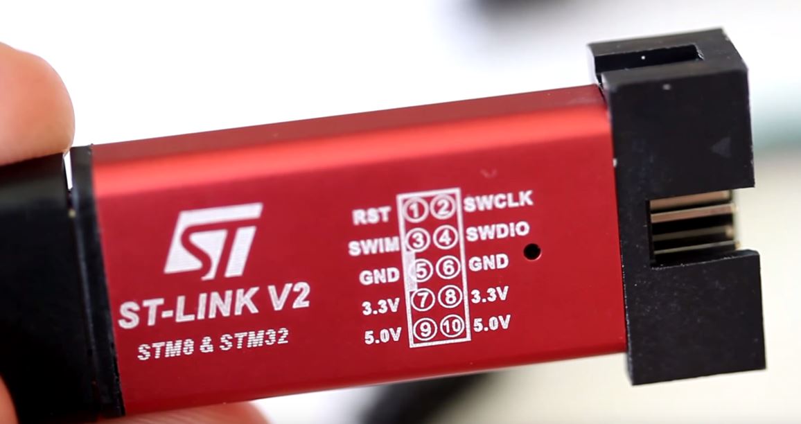 Image of the ST-Link v2 and the pinout of the ST-Link v2 STM32 interface.
